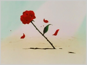 Una rosa rossa conficcata nel terreno indica che Tuxedo Kamen è arrivato sul campo di battaglia